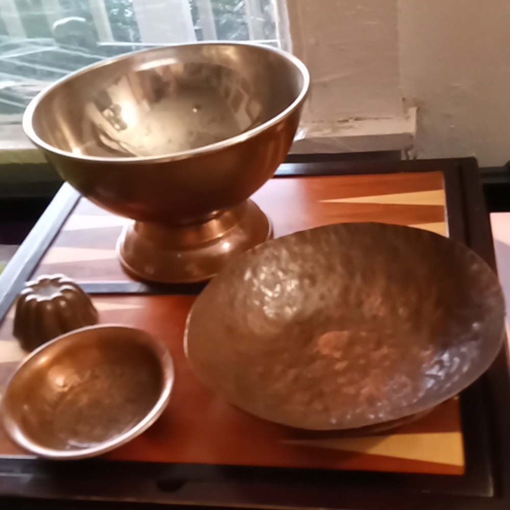 Copper vintage serving bowl and other copper kitchenware.